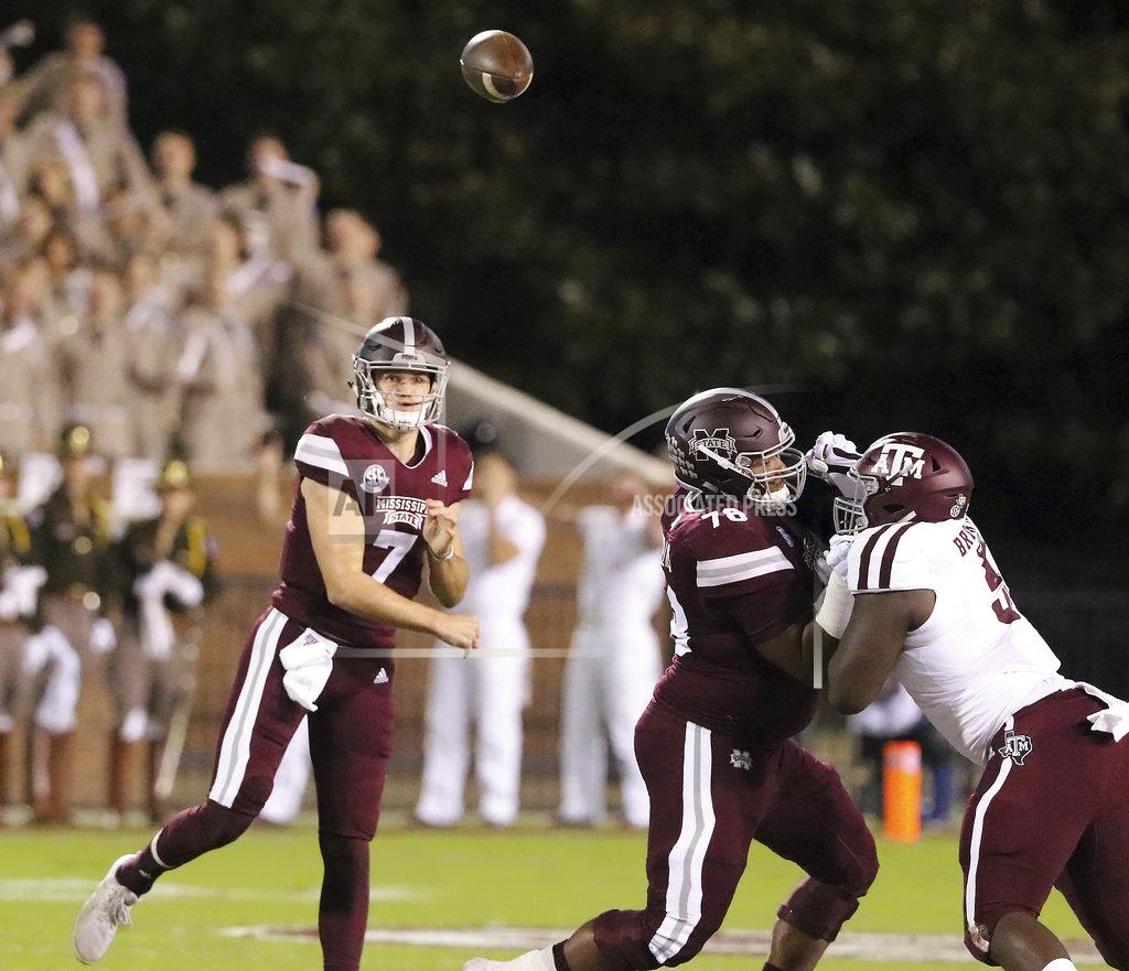 Jim Lytle Mississippi State quarterback Nick Fitzgerald (7) throws a pass as offensive lineman Tyre Phillips (78) blocks Texas A&M defensive lineman Bobby Brown III (5) during the first half of an NCAA college football game on Saturday, Oct. 27, 2018, in Starkville, Miss. (AP Photo/Jim Lytle)