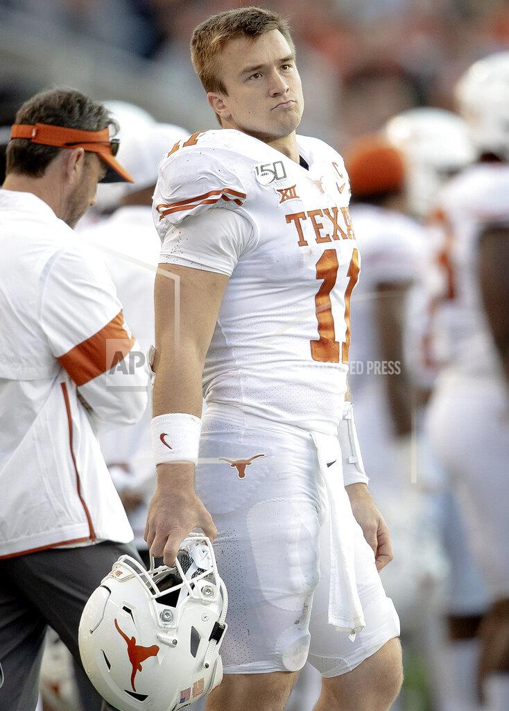 Nick Wagner Texas quarterback Sam Ehlinger (11) stands on the sideline during an NCAA college football game against Baylor on Saturday, Nov. 23, 2019, in Waco, Texas. (Nick Wagner/Austin American-Statesman via AP)