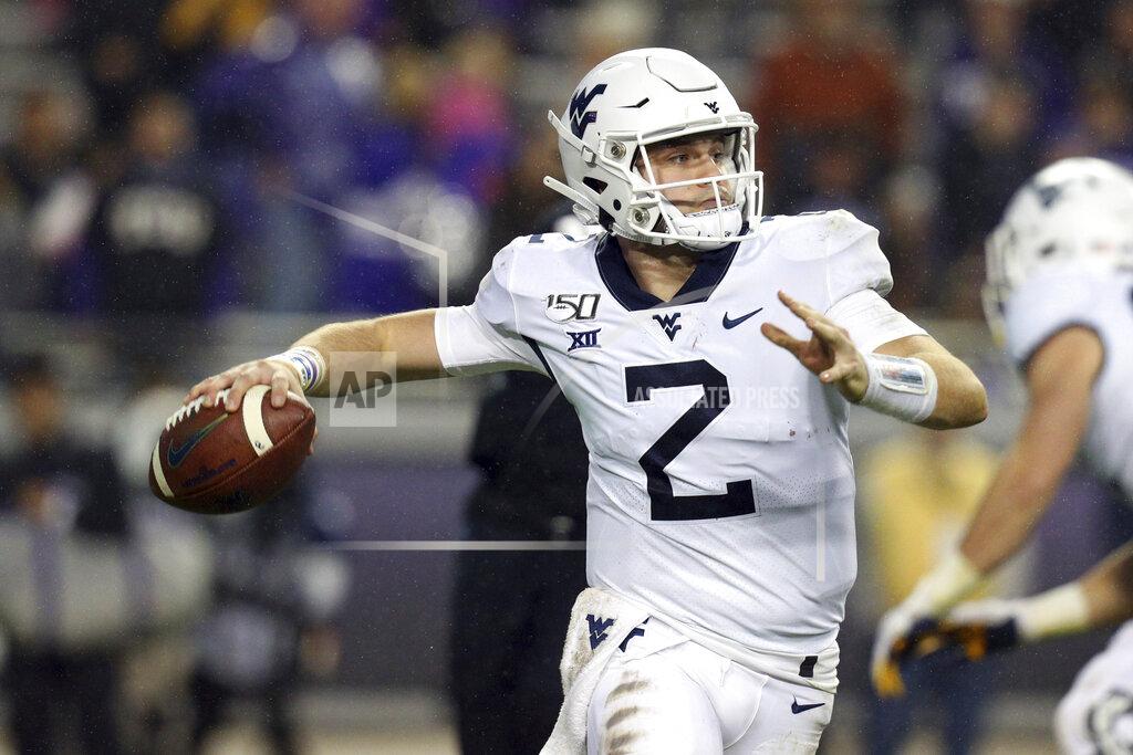 Richard W. Rodriguez FILE - In this Nov. 29, 2019, file photo, West Virginia quarterback Jarret Doege (2) looks for an open receiver against TCU in an NCAA college football game in Fort Worth, Texas. Doege started three games during a redshirt season in 2019 and is battling veteran Austin Kendall to win the starting job again. (AP Photo/Richard W. Rodriguez, File)