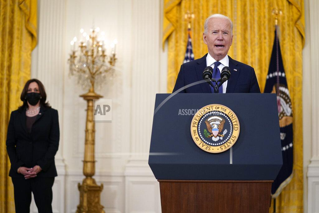 Evan Vucci Vice President Kamala Harris listens as President Joe Biden speaks about the economy, in the East Room of the White House, Monday, May 10, 2021, in Washington. (AP Photo/Evan Vucci)
