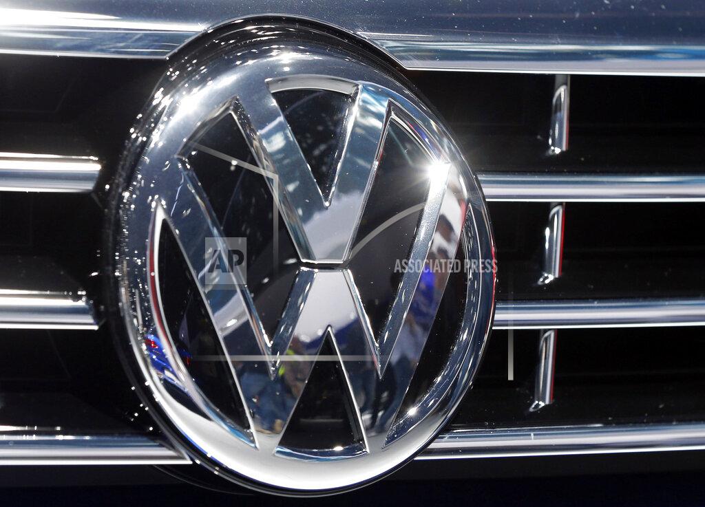 Michael Probst FILE - In this Sept. 22, 2015, file photo, the logo of Volkswagen at a car is photographed during the Car Show in Frankfurt, Germany. Luxury brands Audi and Porsche are fattening the bottom line at German automaker Volkswagen. The company's premium brands saw record sales in the first half of the year. That helped the Wolfsburg-based auto giant make more money than it did even before the pandemic. The company made 11.4 billion euros, or $13.5 billion, in the first half of the year.(AP Photo/Michael Probst, File)