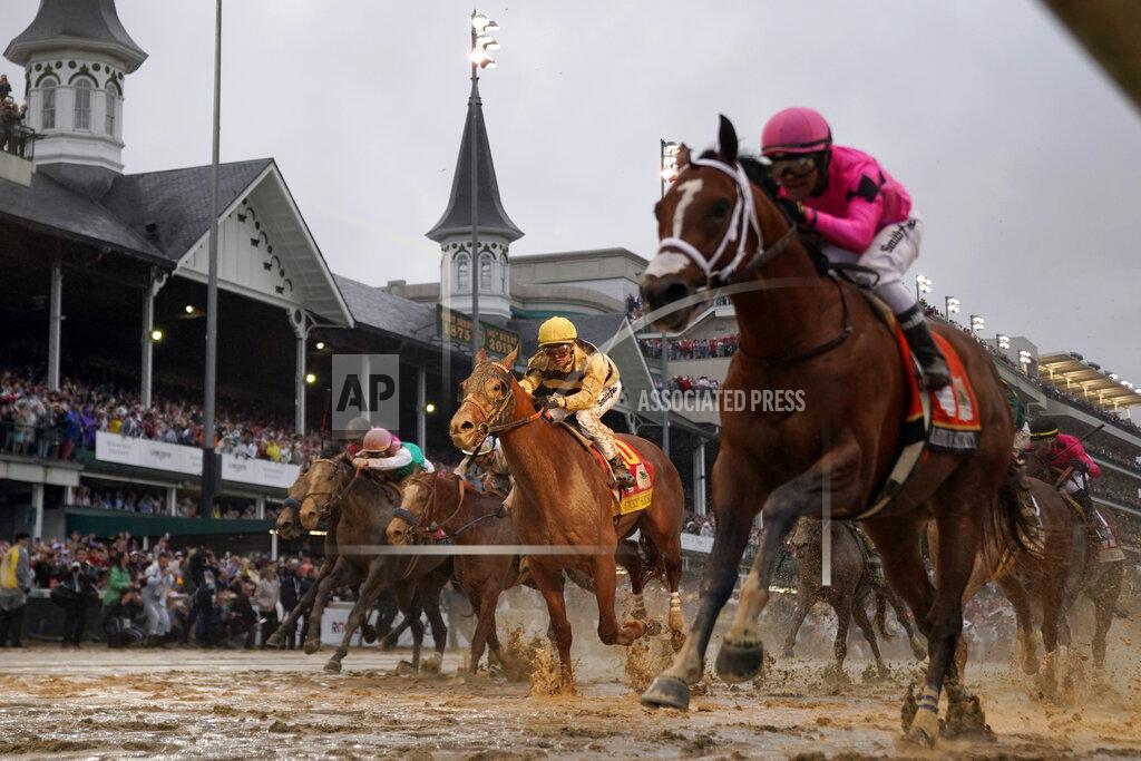 Matt Slocum FILE - In this May 4, 2019, file photo, jockey Flavien Prat, aboard Country House, center, looks on as jockey Luis Saez, right, aboard Maximum Security, crosses the finish line during the 145th running of the Kentucky Derby horse race at Churchill Downs in Louisville, Ky. Maximum Security crossed the finish line first in the 2019 Kentucky Derby. What happened next set horse racing off on a year-long odyssey of chaos. From a historic DQ to doping, lawsuits to a global pandemic, and then a Triple Crown turned upside down. (AP Photo/Matt Slocum, File)