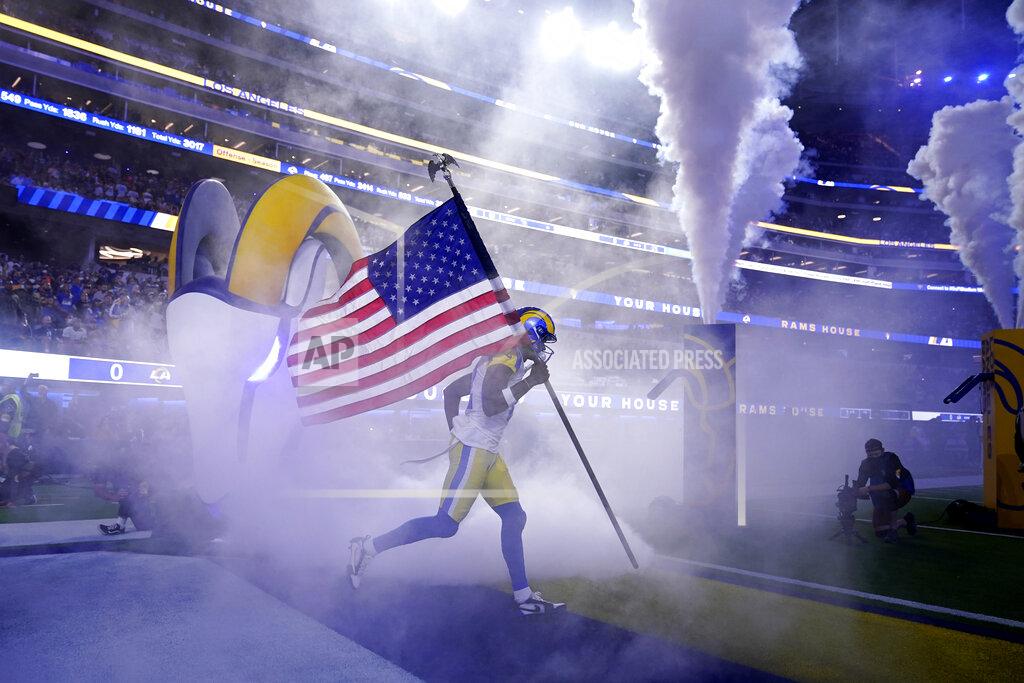 Marcio Jose Sanchez Los Angeles Rams wide receiver Van Jefferson carries a flag as part of the league's Salute to Service before an NFL football game against the Tennessee Titans, Sunday, Nov. 7, 2021, in Inglewood, Calif. (AP Photo/Marcio Jose Sanchez)