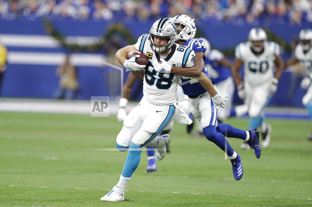 Michael Conroy Carolina Panthers' Greg Olsen (88) is tackled by Indianapolis Colts' Rock Ya-Sin (34) during the first half of an NFL football game, Sunday, Dec. 22, 2019, in Indianapolis. (AP Photo/Michael Conroy)