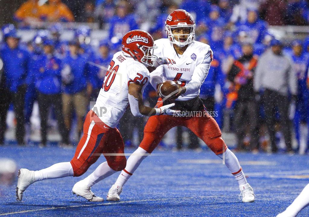 Steve Conner Fresno State quarterback Marcus McMaryion (6) looks to hand the ball off to running back Ronnie Rivers (20) against Boise State during the first half of an NCAA college football game for the Mountain West championship, Saturday, Dec. 1, 2018, in Boise, Idaho. (AP Photo/Steve Conner)