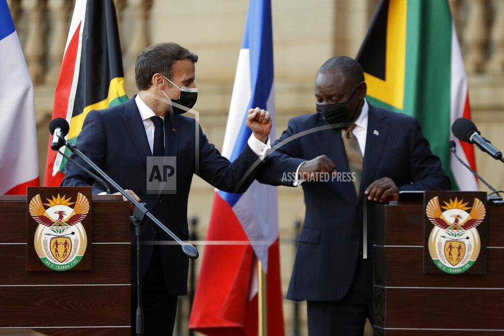 Themba Hadebe South African President Cyril Ramaphosa, right, and his French counterpart Emmanuel Macron attend a press conference at the government's Union Building, in Pretoria, South Africa, Friday, May 28, 2021. Macron is on a two-day official visit to the country. (AP Photo/Themba Hadebe, Pool)