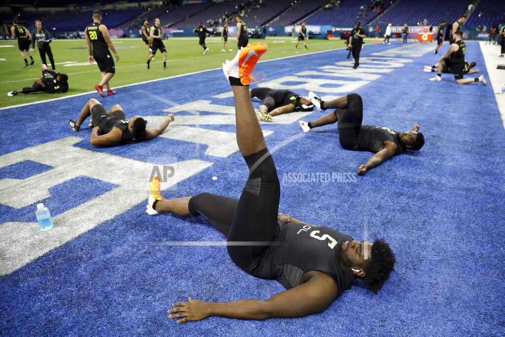 Charlie Neibergall Louisville offensive lineman Mekhi Becton stretches at the NFL football scouting combine in Indianapolis, Friday, Feb. 28, 2020. (AP Photo/Charlie Neibergall)
