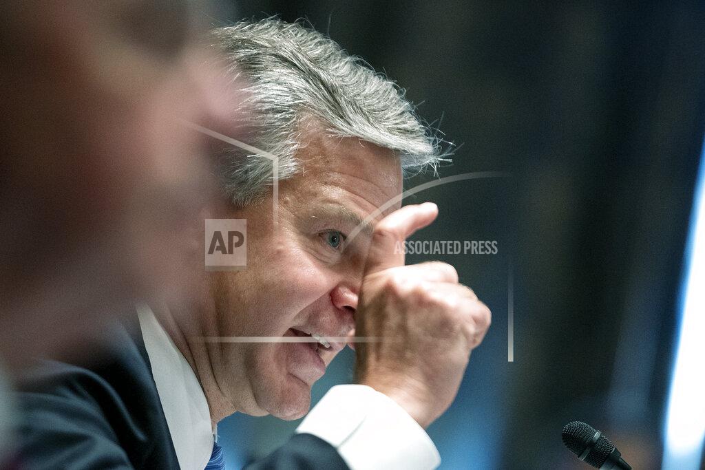 Greg Nash FBI Director Christopher Wray testifies before a Senate Homeland Security and Governmental Affairs Committee hearing to discuss security threats 20 years after the 9/11 terrorist attacks, Tuesday, Sept. 21, 2021 on Capitol Hill in Washington. (Greg Nash/Pool via AP)