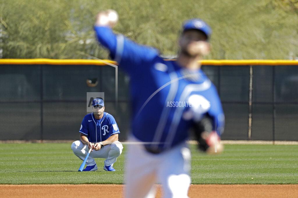 Charlie Riedel FILE - In this Feb. 16, 2020, file photo, Kansas City Royals manager Mike Matheny, back left, watches as pitcher Jesse Hahn throws during spring training baseball practice in Surprise, Ariz. The Royals had an entire offseason and most of spring training to get to know Mike Matheny. But one unintended consequence of the coronavirus pandemic is they've gotten to know their new manager better than they could ever have imagined. (AP Photo/Charlie Riedel, File)