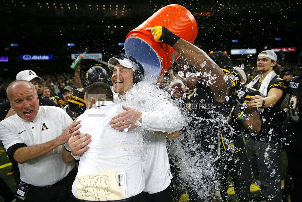 Gerald Herbert Players dunk Appalachian State interim head coach Mark Ivey with ice water in the closing seconds of the second half of the New Orleans Bowl NCAA college football game against Middle Tennessee in New Orleans, Saturday, Dec. 15, 2018. Appalachian State won 45-13. (AP Photo/Gerald Herbert)