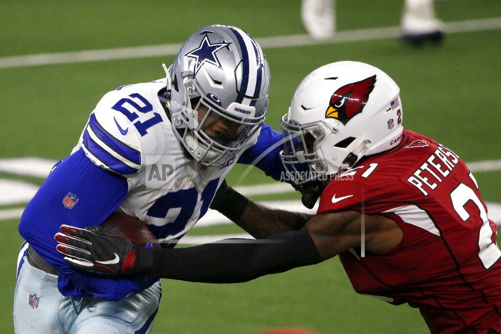 Michael Ainsworth Dallas Cowboys' Ezekiel Elliott (21) gains a first down running the ball against Arizona Cardinals' Patrick Peterson, right, in the second half of an NFL football game in Arlington, Texas, Monday, Oct. 19, 2020. (AP Photo/Michael Ainsworth)