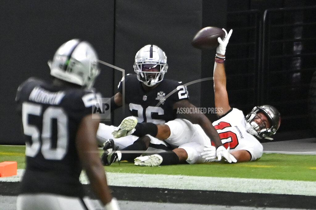 David Becker Tampa Bay Buccaneers wide receiver Scott Miller (10) celebrates after scoring a touchdown over Las Vegas Raiders cornerback Nevin Lawson (26) during the first half of an NFL football game, Sunday, Oct. 25, 2020, in Las Vegas. (AP Photo/David Becker)