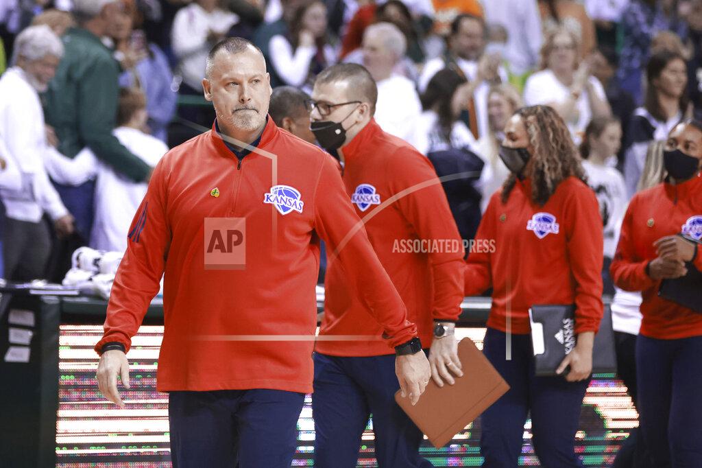 Kansas head coach Brandon Schneider leaves the court following an NCAA college basketball game with Baylor, Saturday, Feb. 26, 2022, in Waco, Texas. (AP Photo/Rod Aydelotte)