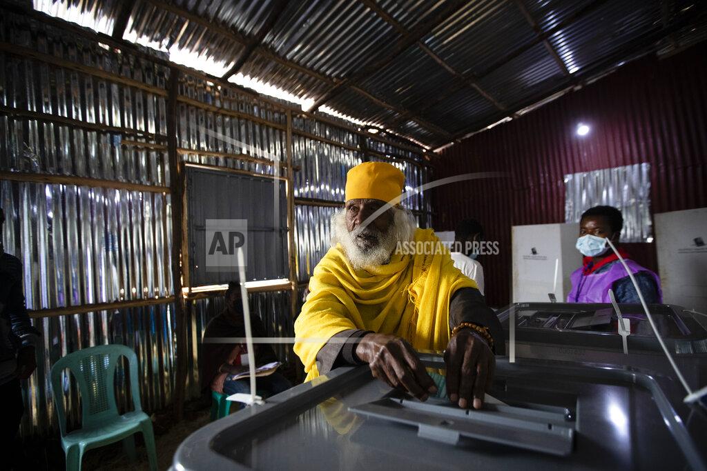 Ben Curtis Monk Tekeste Birhan, 85, casts his vote in the general election at a polling center near Entoto Park on the outskirts of the capital Addis Ababa, Ethiopia Monday, June 21, 2021. Ethiopia began voting Monday in the greatest electoral test yet for Prime Minister Abiy Ahmed as war and logistical issues meant ballots wouldn't be cast in more than 100 of the 547 constituencies across the country. (AP Photo/Ben Curtis)