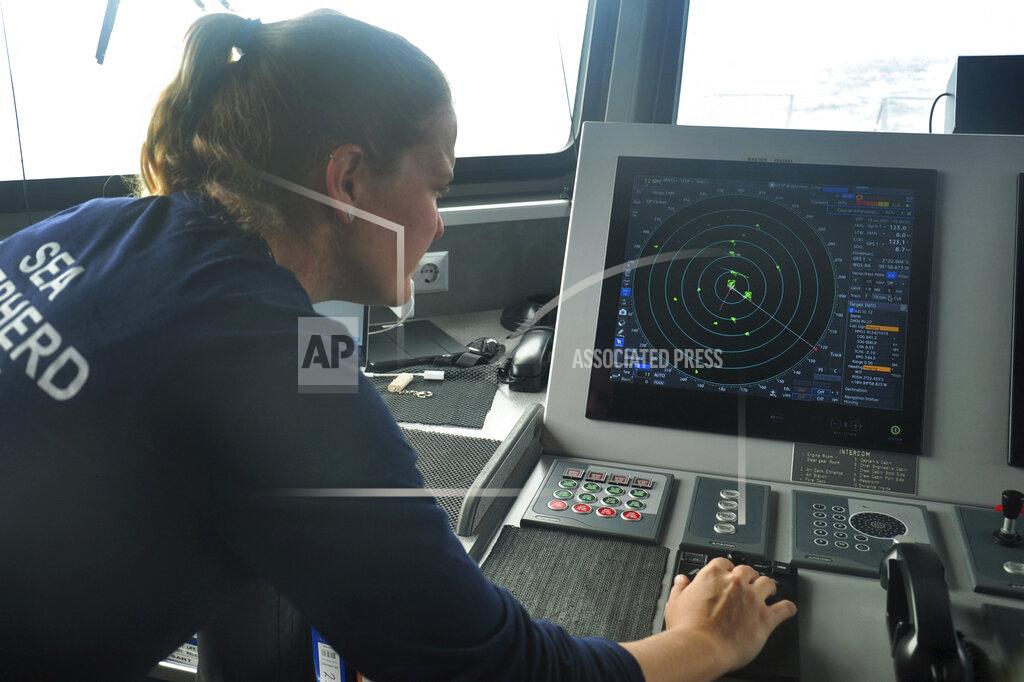 Joshua Goodman Carmen McGregor, second officer of the Ocean Warrior, checks the radar system on July 18, 2021, as part of the ship’s 18-day voyage to observe up close the activities of the Chinese distant water fishing fleet off the west coast of South America. (AP Photo/Joshua Goodman)