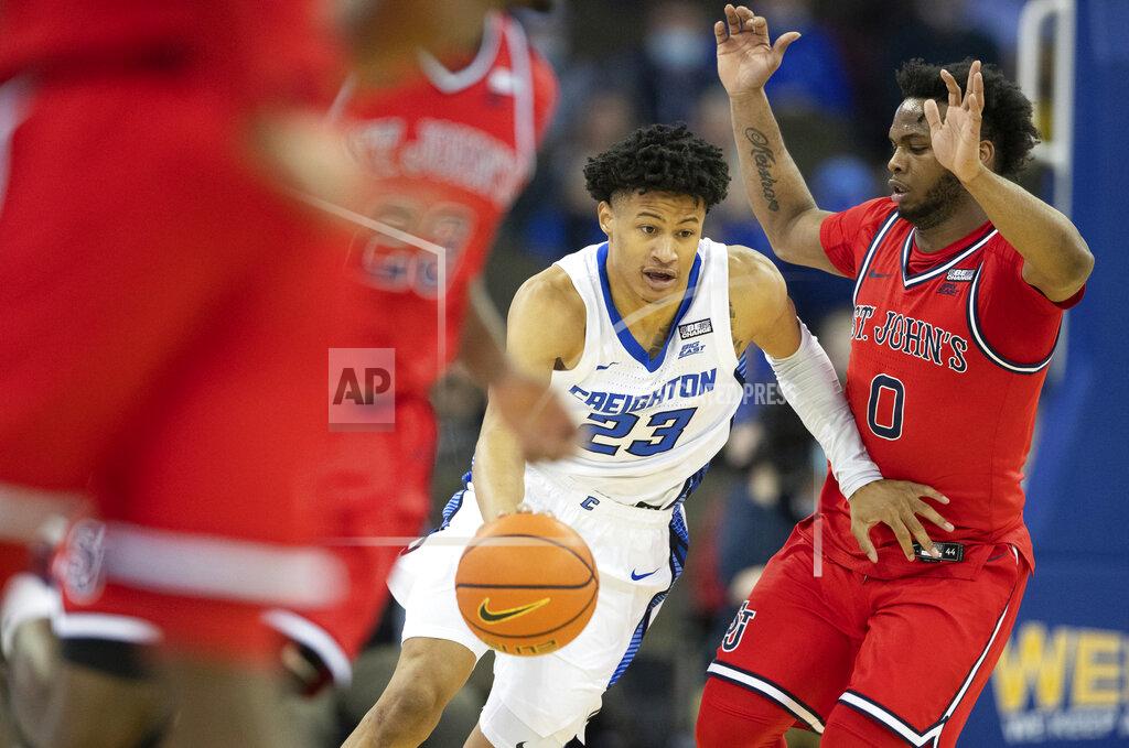 Rebecca S. Gratz Creighton's Trey Alexander (23) carries the ball down court against St. John's Posh Alexander (0) during the first half of an NCAA college basketball game Wednesday, Jan. 19, 2022, in Omaha, Neb. (AP Photo/Rebecca S. Gratz)