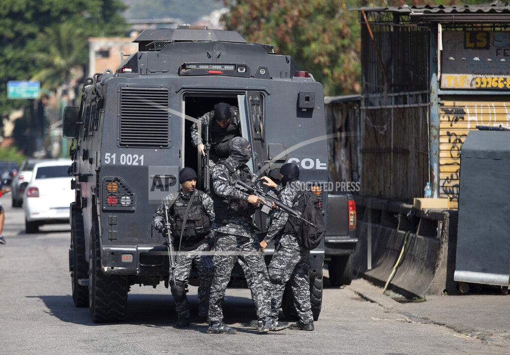 Silvia Izquierdo Police get out of an armored vehicle during an operation against alleged drug traffickers in the Jacarezinho favela of Rio de Janeiro, Brazil, Thursday, May 6, 2021. (AP Photo/Silvia Izquierdo)