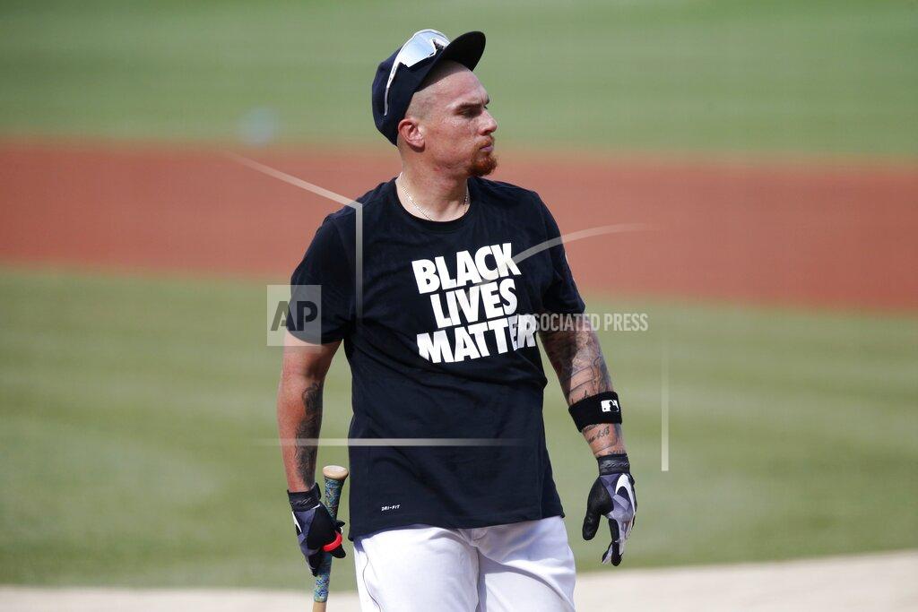 Michael Dwyer Boston Red Sox's Christian Vazquez wears a Black Lives Matter shirt during warmups before an Opening Dday baseball game against the Baltimore Orioles at Fenway Park, Friday, July 24, 2020, in Boston. (AP Photo/Michael Dwyer)