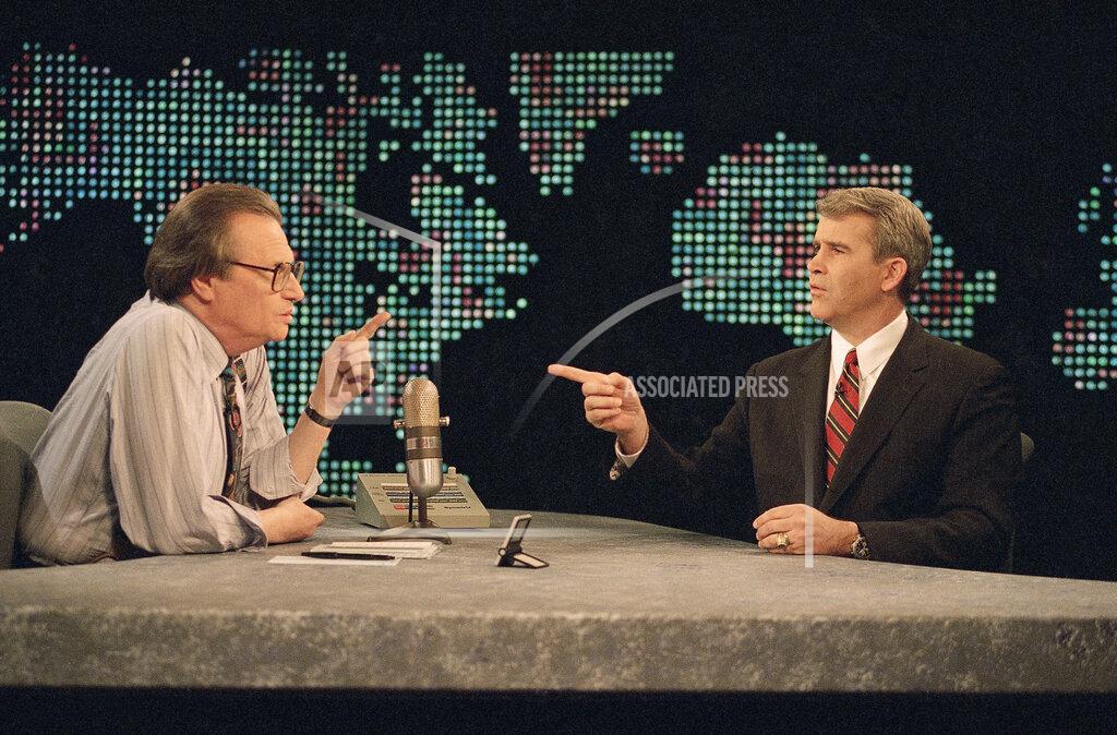 Shayna Brennan FILE - IN this Jan. 26, 1994 file photo, Oliver North talks to television show host Larry King prior to the start of CNN's 'Larry King Live' in Washington. King, who interviewed presidents, movie stars and ordinary Joes during a half-century in broadcasting, has died at age 87. Ora Media, the studio and network he co-founded, tweeted that King died Saturday, Jan. 23, 2021 morning at Cedars-Sinai Medical Center in Los Angeles. (AP Photo/Shayna Brennan, File)