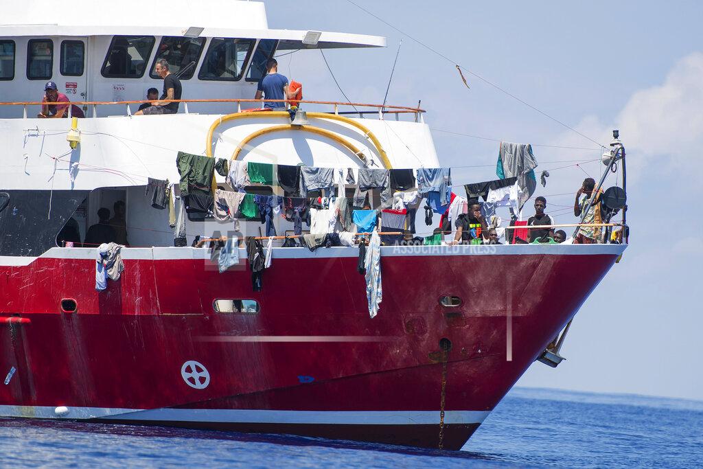 Rene' Rossignaud In this photo taken Tuesday, June 2, 2020, migrants dry their clothes aboard a tourist boats some 20 kilometers from Malta, . More than 400 migrants are living aboard pleasure cruise vessels, bobbing in the sea off Malta, many of them for weeks now. Rescued from human traffickers’ unseaworthy boats in several operations in the central Mediterranean since late April, the migrants, along with the Maltese government, are waiting for European Union countries to offer to take them. (AP Photo/Rene' Rossignaud)