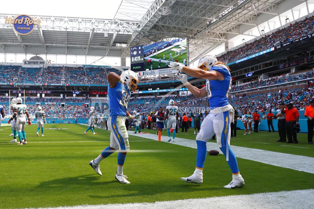 Wilfredo Lee Los Angeles Chargers running back Austin Ekeler (30) and tight end Sean Culkin (80) celebrate after Ekeler scored a touchdown, during the first half at an NFL football game against the Miami Dolphins, Sunday, Sept. 29, 2019, in Miami Gardens, Fla. (AP Photo/Wilfredo Lee)
