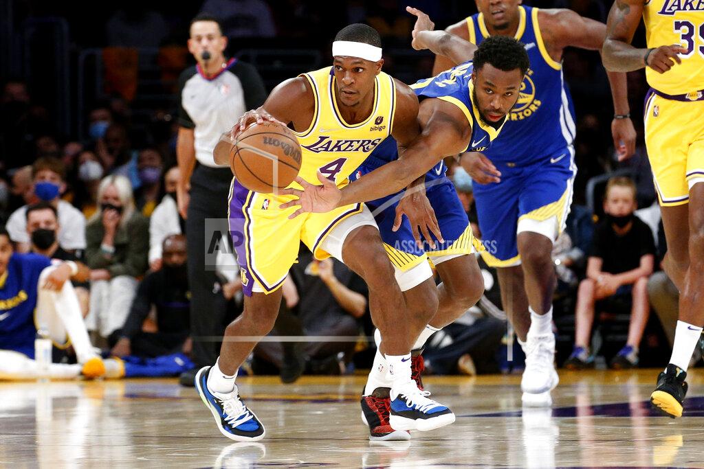 Ringo H.W. Chiu Los Angeles Lakers guard Rajon Rondo (4) and Golden State Warriors forward Andrew Wiggins (22) vie for the ball during the first half of an NBA basketball game in Los Angeles, Tuesday, Oct. 19, 2021. (AP Photo/Ringo H.W. Chiu)