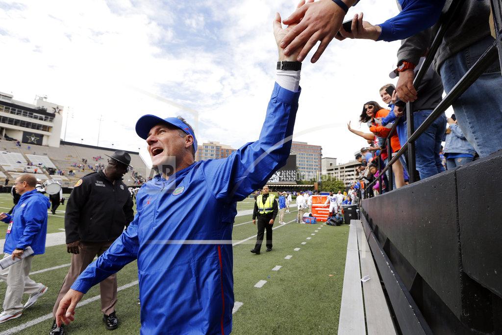 Mark Humphrey Florida head coach Dan Mullen celebrates with fans after the Gators defeated Vanderbilt 37-27 in an NCAA college football game Saturday, Oct. 13, 2018, in Nashville, Tenn. (AP Photo/Mark Humphrey)