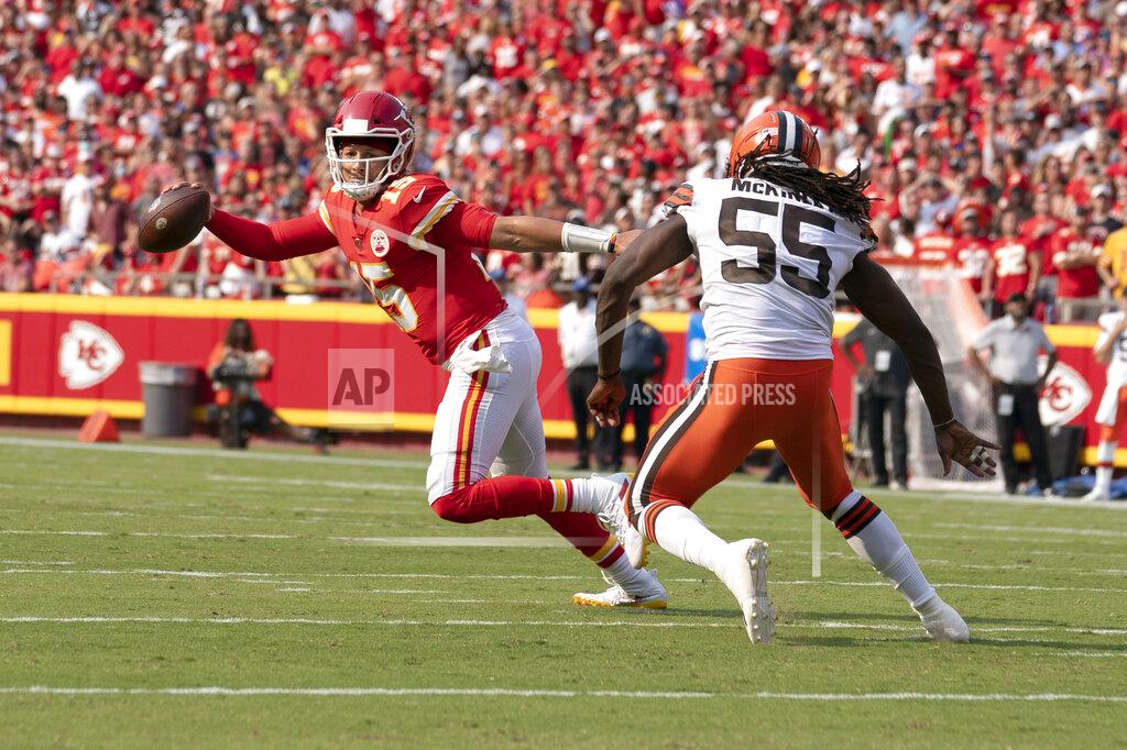 Ed Zurga Kansas City Chiefs quarterback Patrick Mahomes, left, scrambles away from Cleveland Browns defensive end Takkarist McKinley (55) during the first half of an NFL football game Sunday, Sept. 12, 2021, in Kansas City, Mo. (AP Photo/Ed Zurga)