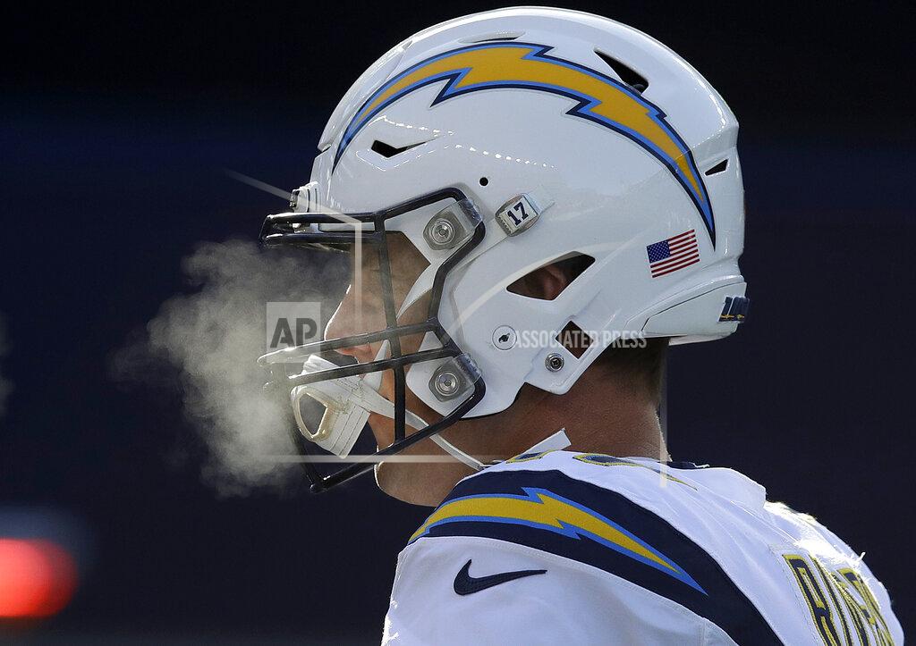 Charles Krupa Los Angeles Chargers quarterback Philip Rivers warms up before an NFL divisional playoff football game against the New England Patriots, Sunday, Jan. 13, 2019, in Foxborough, Mass. (AP Photo/Charles Krupa)