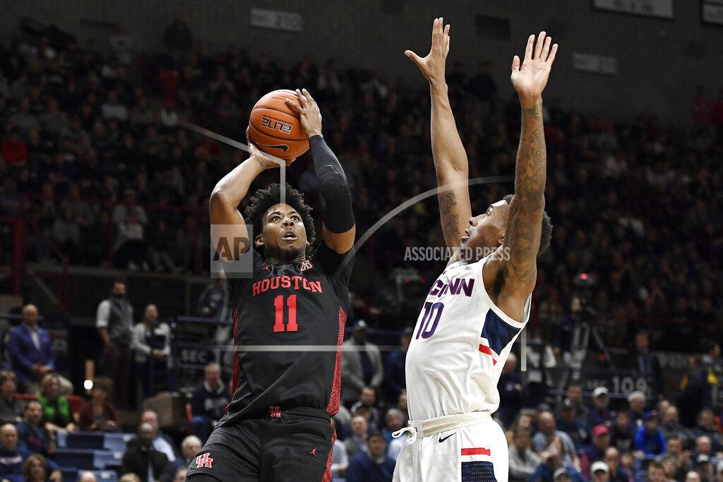 Jessica Hill Houston's Nate Hinton (11) shoots over Connecticut's Brendan Adams (10) in the second half of an NCAA college basketball game, Thursday, March 5, 2020, in Storrs, Conn. (AP Photo/Jessica Hill)