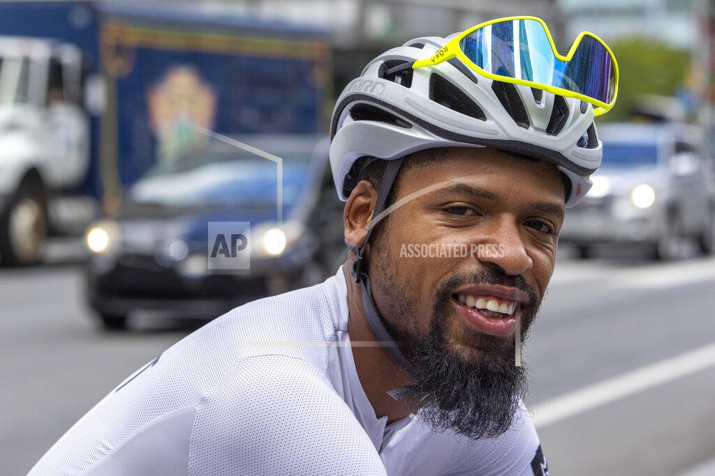 Alejandro A. Alvarez Siddeeq Shabazz rides his bicycle by Philadelphia City Hall on Friday, Sept. 3, 2021. Shabazz got into cycling because of the pandemic. Now he rides 200 miles a week, leads team rides and has been on the cover of a bicycling publication. (Alejandro A. Alvarez/The Philadelphia Inquirer via AP)