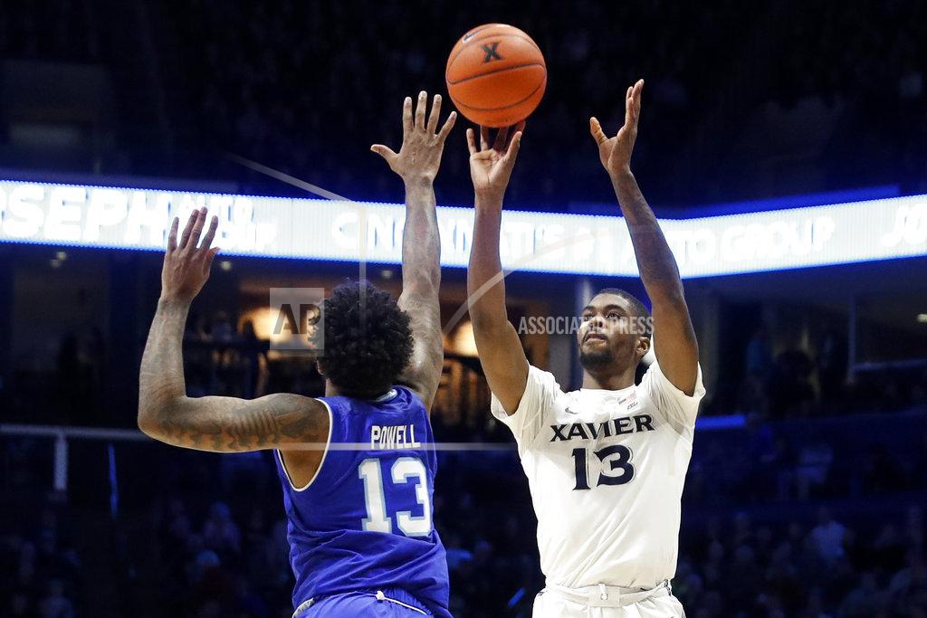 John Minchillo Xavier's Naji Marshall, right, shoots as Seton Hall's Myles Powell defends during the first half of an NCAA college basketball game Wednesday, Jan. 2, 2019, in Cincinnati. (AP Photo/John Minchillo)