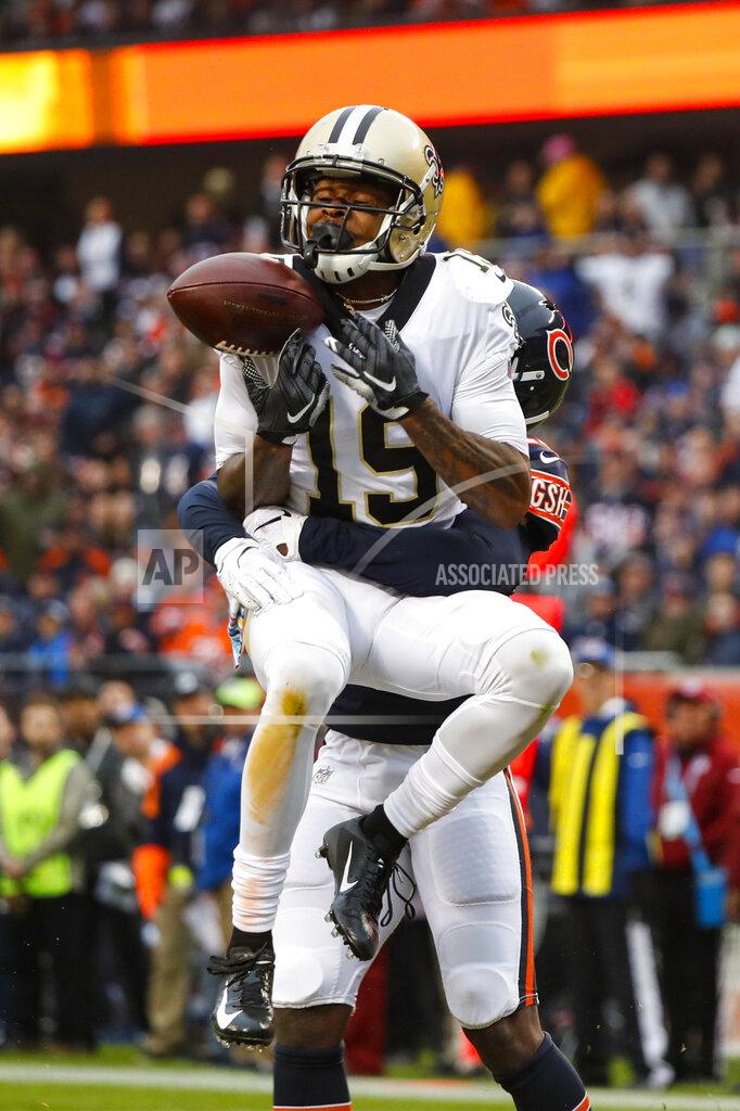 Charles Rex Arbogast New Orleans Saints wide receiver Ted Ginn (19) drops a pass in the end zone as he's hit by Chicago Bears cornerback Prince Amukamara (20) during the first half of an NFL football game in Chicago, Sunday, Oct. 20, 2019. (AP Photo/Charles Rex Arbogast)