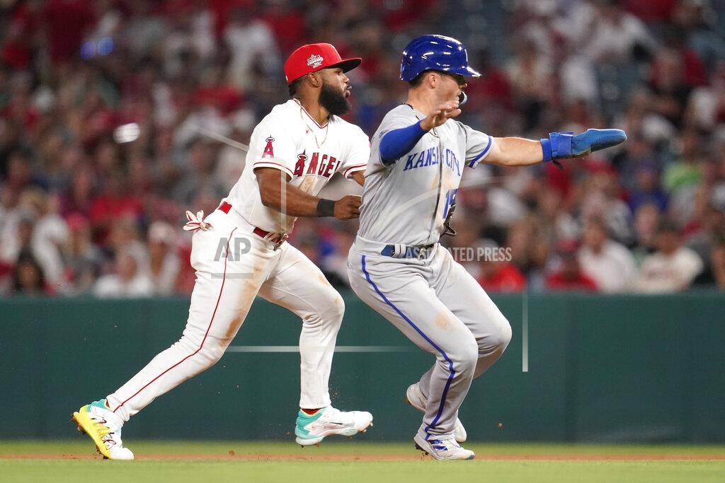 Ashley Landis Los Angeles Angels second baseman Luis Rengifo, left, tags out Kansas City Royals' Whit Merrifield before throwing to first to out Andrew Benintendi during the sixth inning of a baseball game in Anaheim, Calif., Wednesday, June 22, 2022. (AP Photo/Ashley Landis)