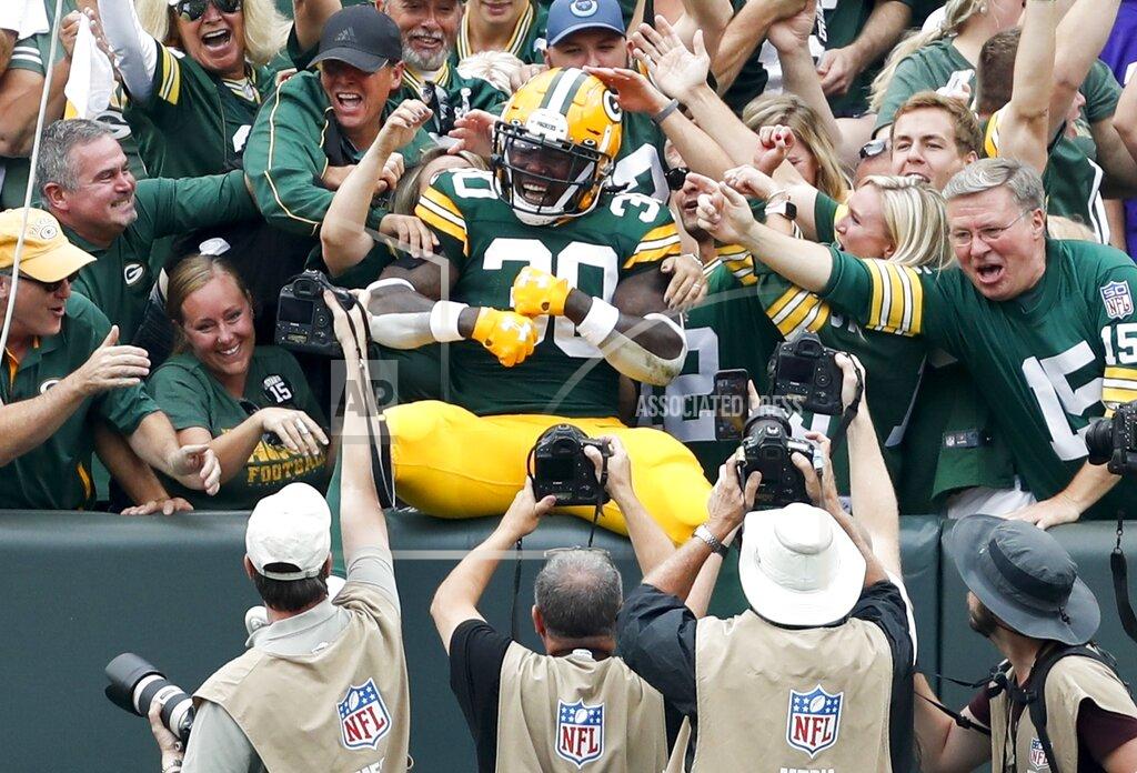 Matt Ludtke Green Bay Packers' Jamaal Williams celebrates his touchdown during the first half of an NFL football game against the Minnesota Vikings Sunday, Sept. 15, 2019, in Green Bay, Wis. (AP Photo/Matt Ludtke)