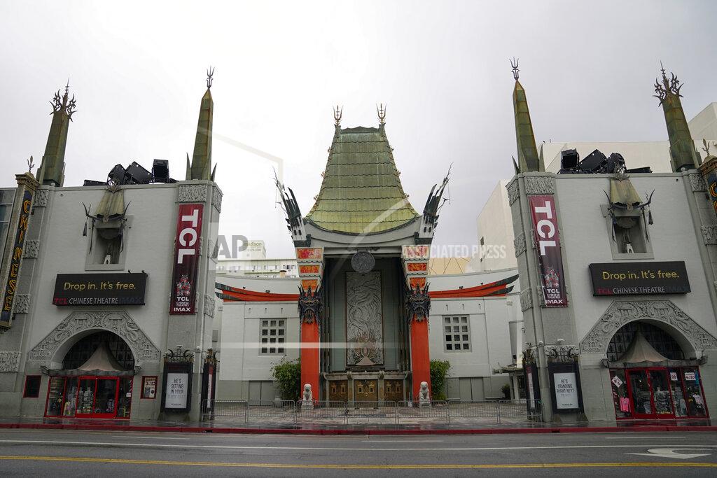 Ashley Landis FILE - In this May 18, 2020, file photo, the TCL Chinese Theatre is shown with no people present in the Hollywood area of Los Angeles. Los Angeles County is expected to move Tuesday, May 4, 2021, into the least-restrictive yellow tier, amid the coronavirus pandemic. (AP Photo/Ashley Landis, File)