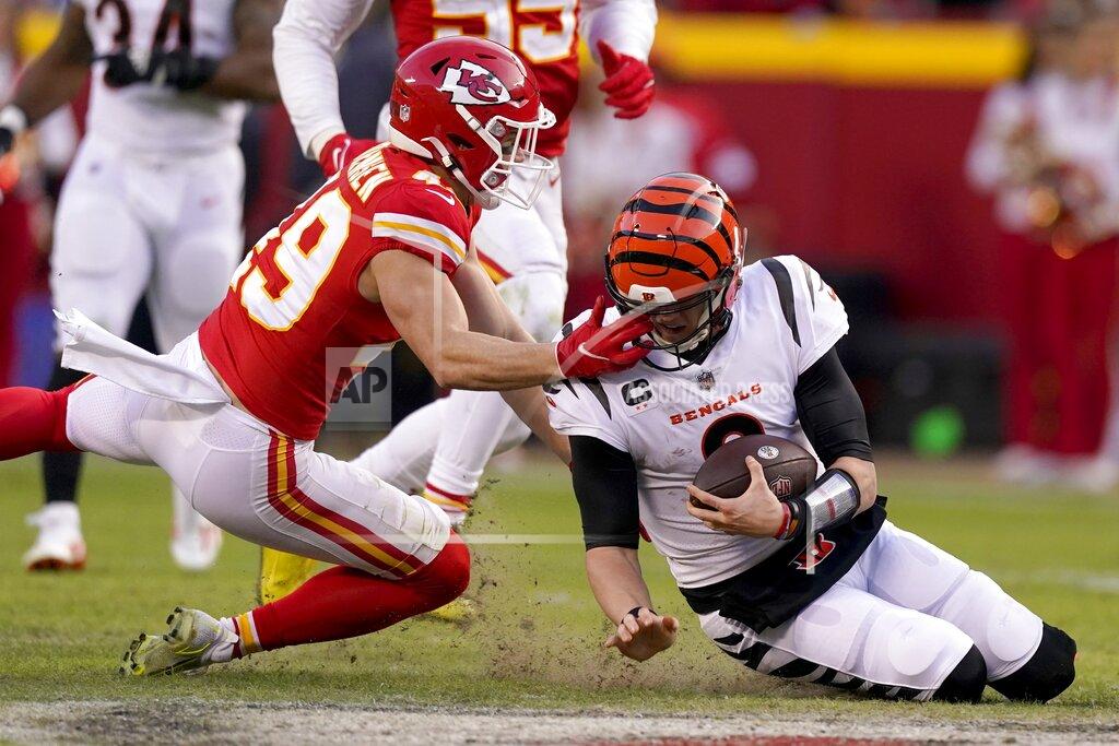 Charlie Riedel Kansas City Chiefs safety Daniel Sorensen (49) defends against a run by Cincinnati Bengals quarterback Joe Burrow, right, during the second half of the AFC championship NFL football game, Sunday, Jan. 30, 2022, in Kansas City, Mo. (AP Photo/Charlie Riedel)