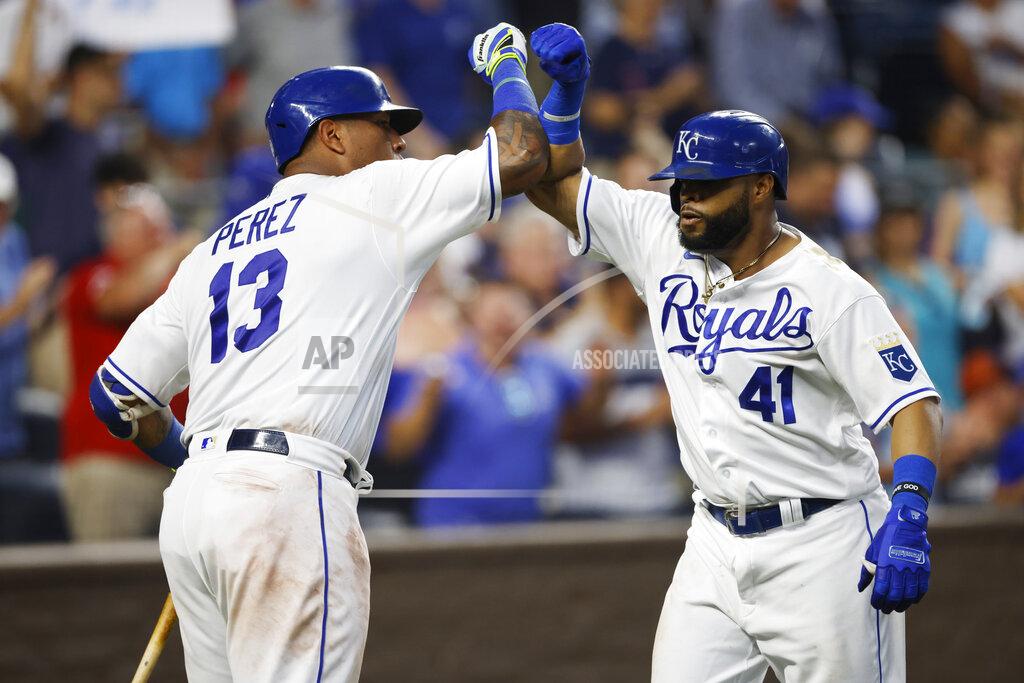 Colin E. Braley Kansas City Royals' Carlos Santana (41) is congratulated by teammate Salvador Perez (13) after hitting a go-ahead three-run home run during the seventh inning of a baseball game against the Detroit Tigers at Kauffman Stadium in Kansas City, Mo., Saturday, July 24, 2021. (AP Photo/Colin E. Braley)