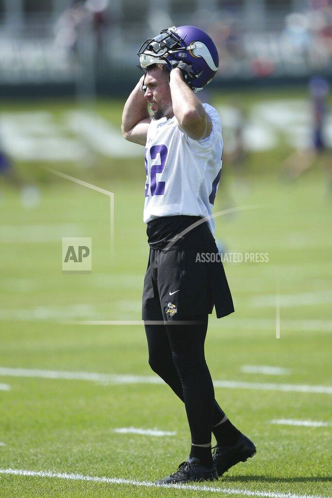 Jim Mone Minnesota Vikings free safety Harrison Smith puts on his helmet preparing for a drill during the NFL football team's training camp Friday, July 26, 2019, in Eagan, Minn. (AP Photo/Jim Mone)