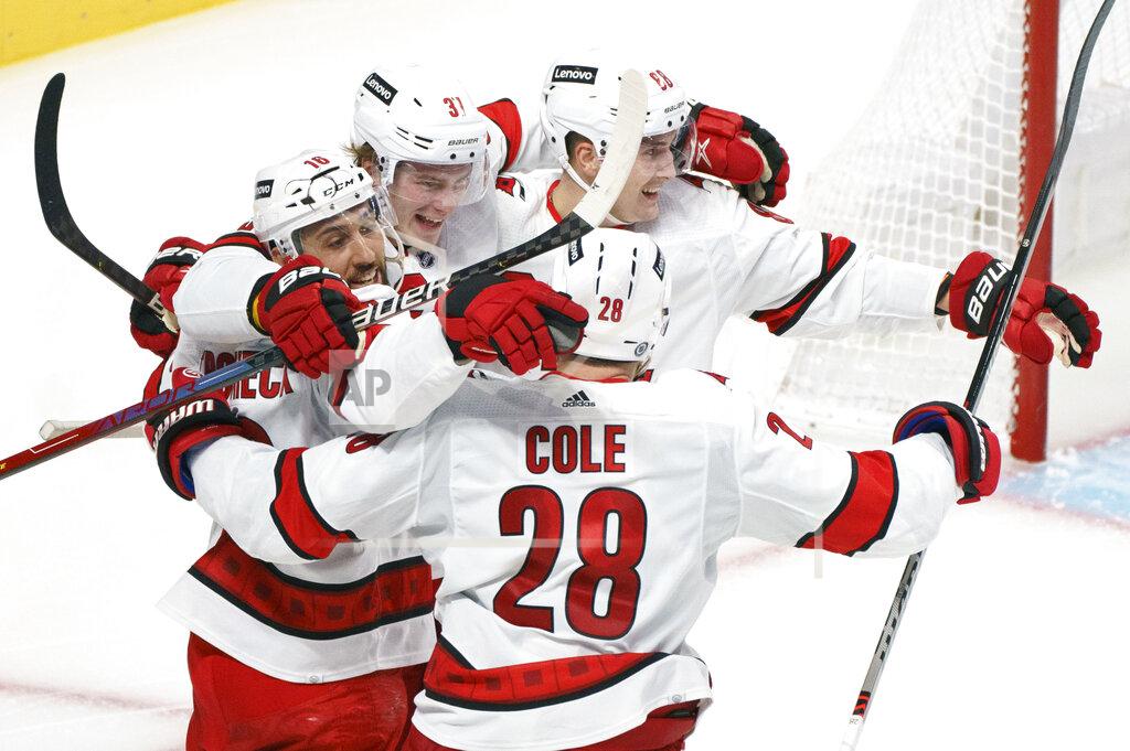 Paul Chiasson Carolina Hurricanes' Andrei Svechnikov (37) celebrates his goal against the Montreal Canadiens with Vincent Trocheck, left, Martin Necas, right, and Ian Cole during the second period of an NHL hockey game Thursday, Oct. 21, 2021, in Montreal. (Paul Chiasson/The Canadian Press via AP)