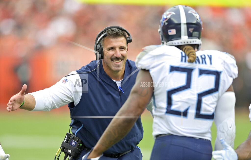 David Richard Tennessee Titans head coach Mike Vrabel, left, congratulates running back Derrick Henry after Henry scored a 1-yard touchdown during the first half in an NFL football game against the Cleveland Browns, Sunday, Sept. 8, 2019, in Cleveland. (AP Photo/David Richard)
