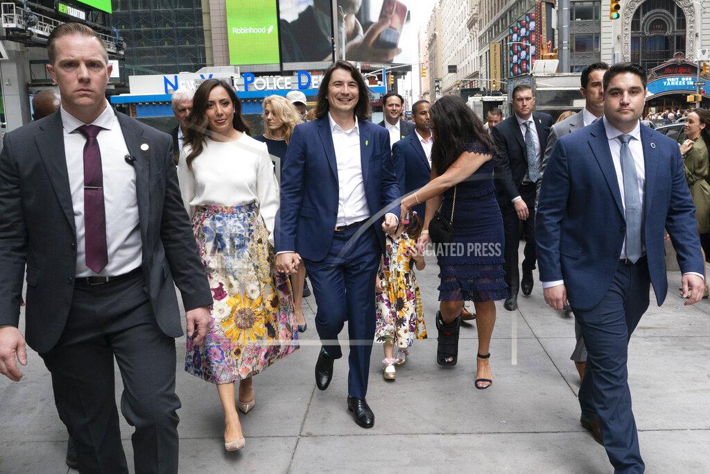 Mark Lennihan Vladimir Tenev, CEO and co-founder of Robinhood, center, walks with his wife Celina in New York's Times Square following his company's IPO, Thursday, July 29, 2021. Robinhood's stock will begin trading Thursday on Wall Street, the very place the online brokerage has rattled with its stated goal of democratizing finance.(AP Photo/Mark Lennihan)