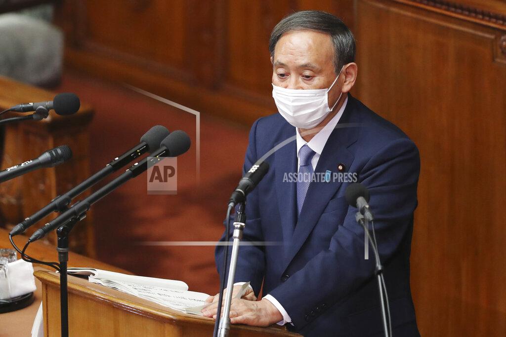 Koji Sasahara Japanese Prime Minister Yoshihide Suga delivers a policy speech during an extraordinary Diet session at the upper house of parliament in Tokyo, Monday, Oct. 26, 2020. Suga has declared Japan will achieve zero carbon emissions by 2050 in his first policy speech after taking over from Shinzo Abe. The policy speech Monday at the outset of the parliamentary session set an ambitious agenda reflecting Suga's pragmatic approach to getting things done. (AP Photo/Koji Sasahara)