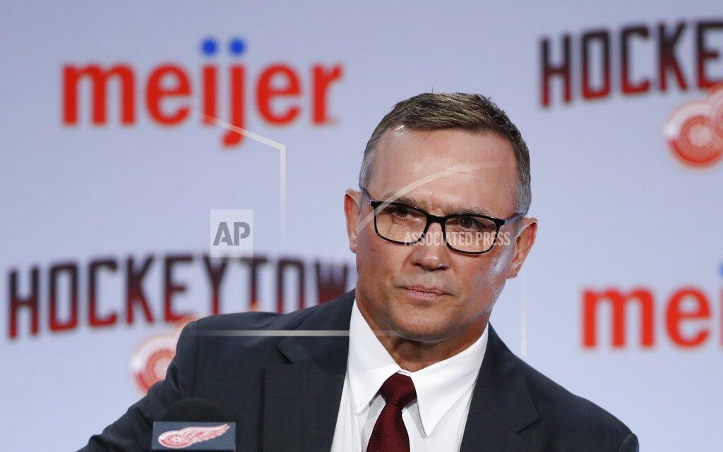 Carlos Osorio File- This April 19, 2019, file photo shows Steve Yzerman being introduced as the new executive vice president and general manager of the Detroit Red Wings during a news conference, in Detroit. The Red Wings are sticking with coach Jeff Blashill for their rebuild. Yzerman made the announcement Tuesday, May 18, 2021, giving Blashill a contract extension despite a five-year postseason drought and a career record of 172-221-62. (AP Photo/Carlos Osorio, File)