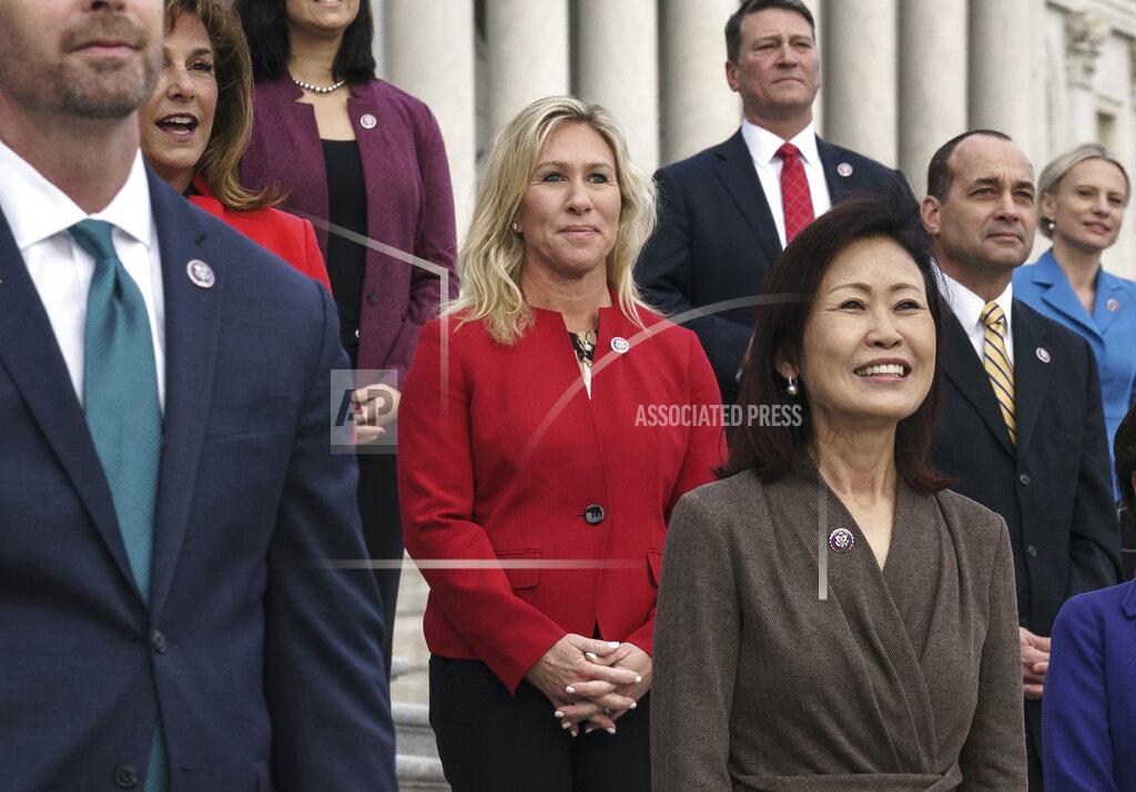 J. Scott Applewhite In this Jan. 4, 2021, photo, Rep. Marjorie Taylor Greene, R-Ga., center, stands with other GOP freshmen during an event at the Capitol in Washington. Republican Senate leader Mitch McConnell is calling the far-right Georgia Republican's embrace of conspiracy theories and "loony lies" a "cancer for the Republican Party." House Democrats are mounting an effort to formally rebuke Greene, who has a history of making racist remarks, promoting conspiracy theories and endorsing violence directed at Democrats. (AP Photo/J. Scott Applewhite)