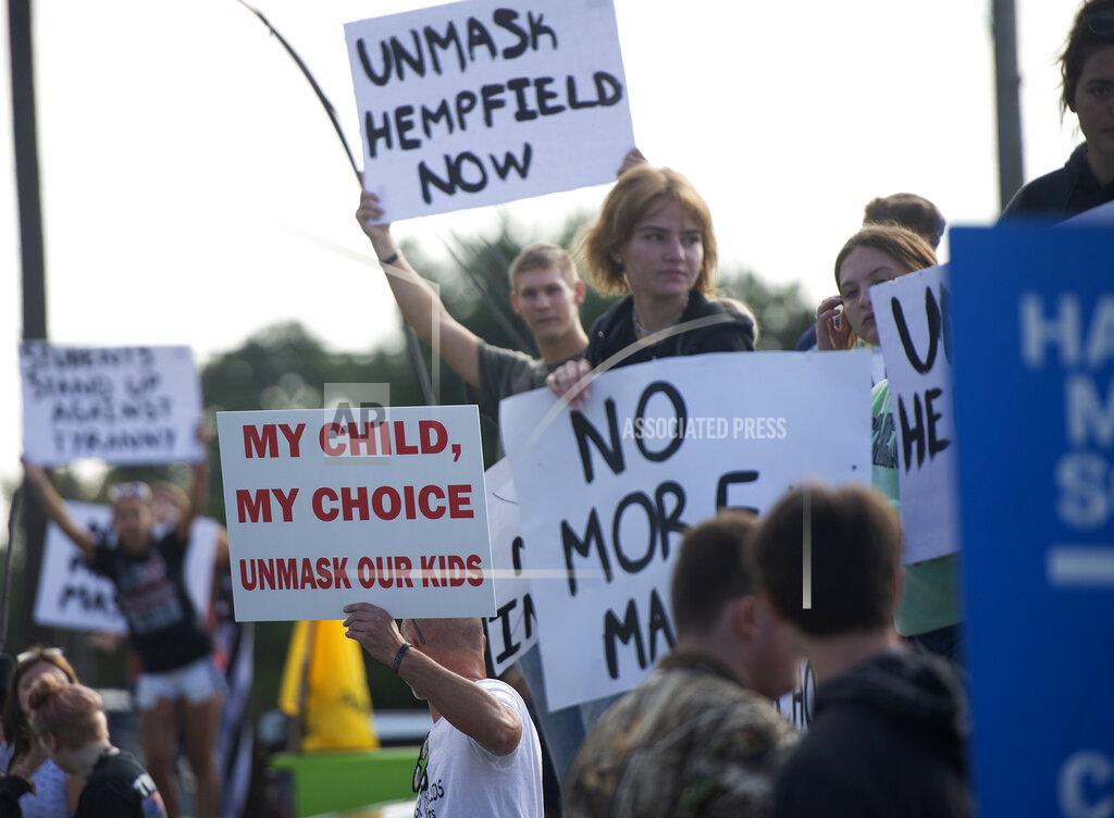 Pam Panchak FILE - In this Sep. 7, 2021, file photo, a group of students and parents rally in front of Hempfield Area High School protesting the first day of the state-wide policy requiring masks to be worn in K-12 schools and daycares in Greensburg, Pa. The summer that was supposed to mark America’s independence from COVID-19 is instead drawing to a close with the U.S. more firmly under the tyranny of the virus, with deaths per day back up to where they were in March 2021. Legal disputes, threats and violence have erupted over mask and vaccine requirements. (Pam Panchak/Pittsburgh Post-Gazette via AP, File)