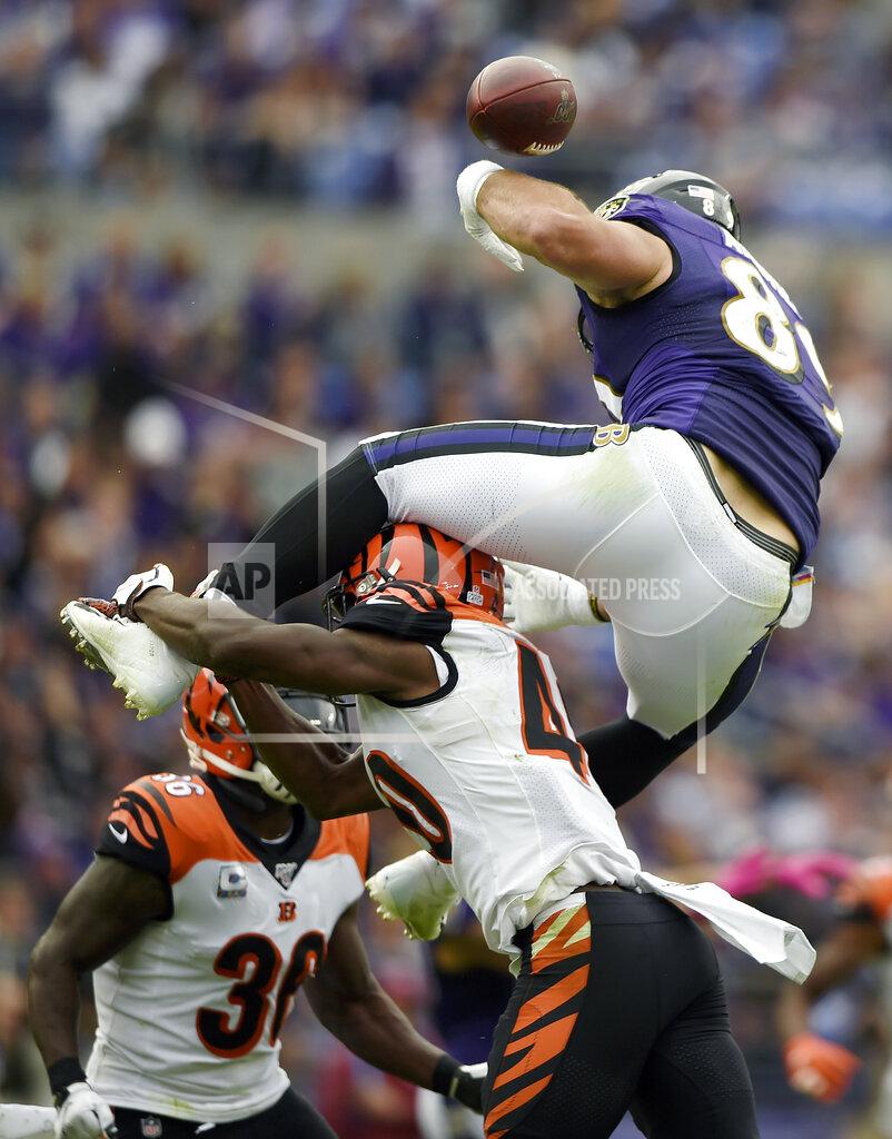 Gail Burton Baltimore Ravens tight end Mark Andrews, top, loses the ball while trying to leap over Cincinnati Bengals defensive back Brandon Wilson during the first half of a NFL football game Sunday, Oct. 13, 2019, in Baltimore. (AP Photo/Gail Burton)