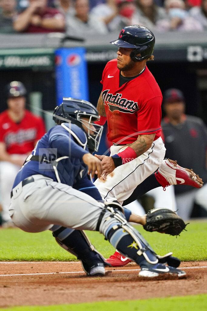 Tony Dejak Cleveland Indians' Harold Ramirez, right, scores as Tampa Bay Rays catcher Francisco Mejia is late on the tag during the fourth inning of a baseball game Thursday, July 22, 2021, in Cleveland. (AP Photo/Tony Dejak)