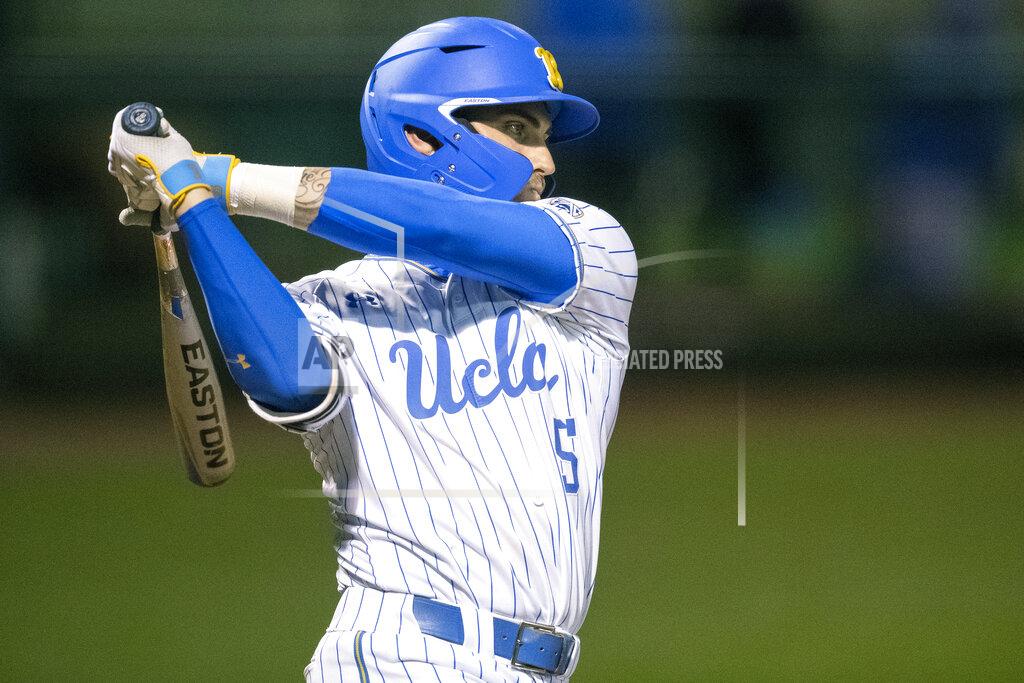 Kyusong Gong FILE - In this Feb. 21, 2020, file photo, UCLA's Garrett Mitchell swings during an NCAA baseball game against St. Mary's, in Los Angeles. Mitchell is expected to be an early selection in the Major League Baseball draft. (AP Photo/Kyusung Gong, File)