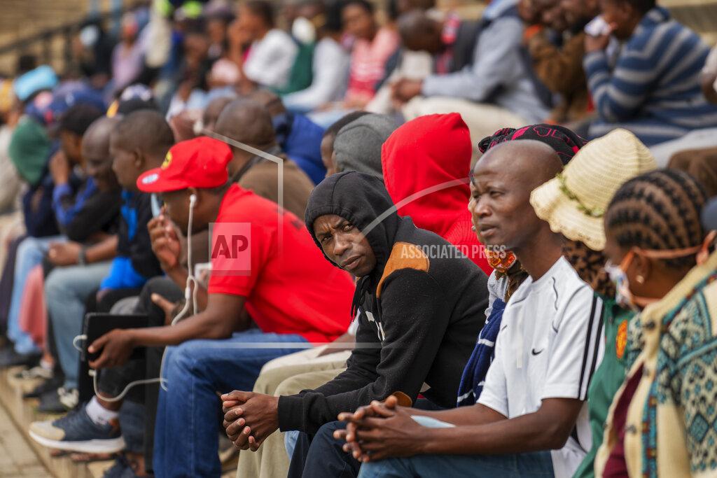 Jerome Delay Residents from the Alexandra township in Johannesburg gather in a stadium to be tested for COVID-19 Monday, April 26, 2020. South Africa will began a phased easing of its strict lockdown measures on May 1, although its confirmed cases of coronavirus continue to increase. (AP Photo/Jerome Delay)